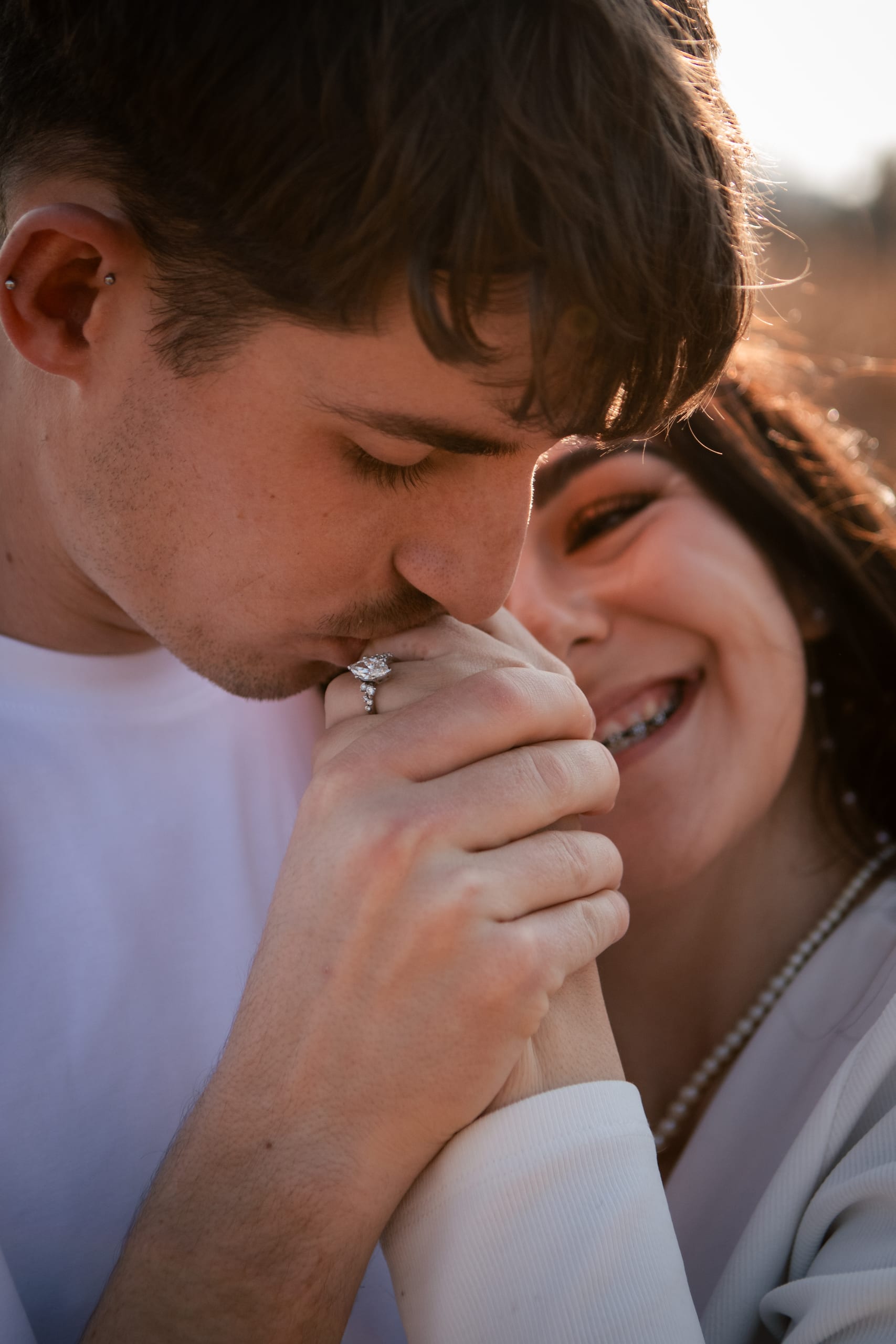 Gareth kissing Shannon's hand with her engagement ring visible