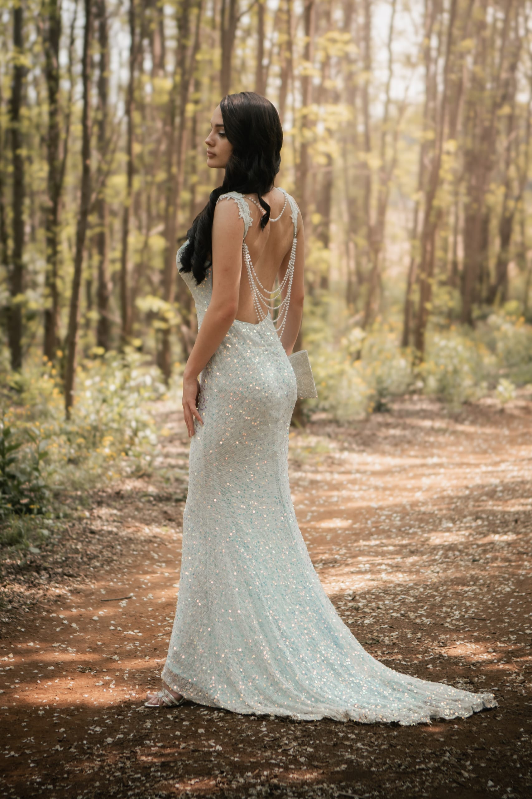 Back detail of a silver-blue matric farewell dress with pearl strands