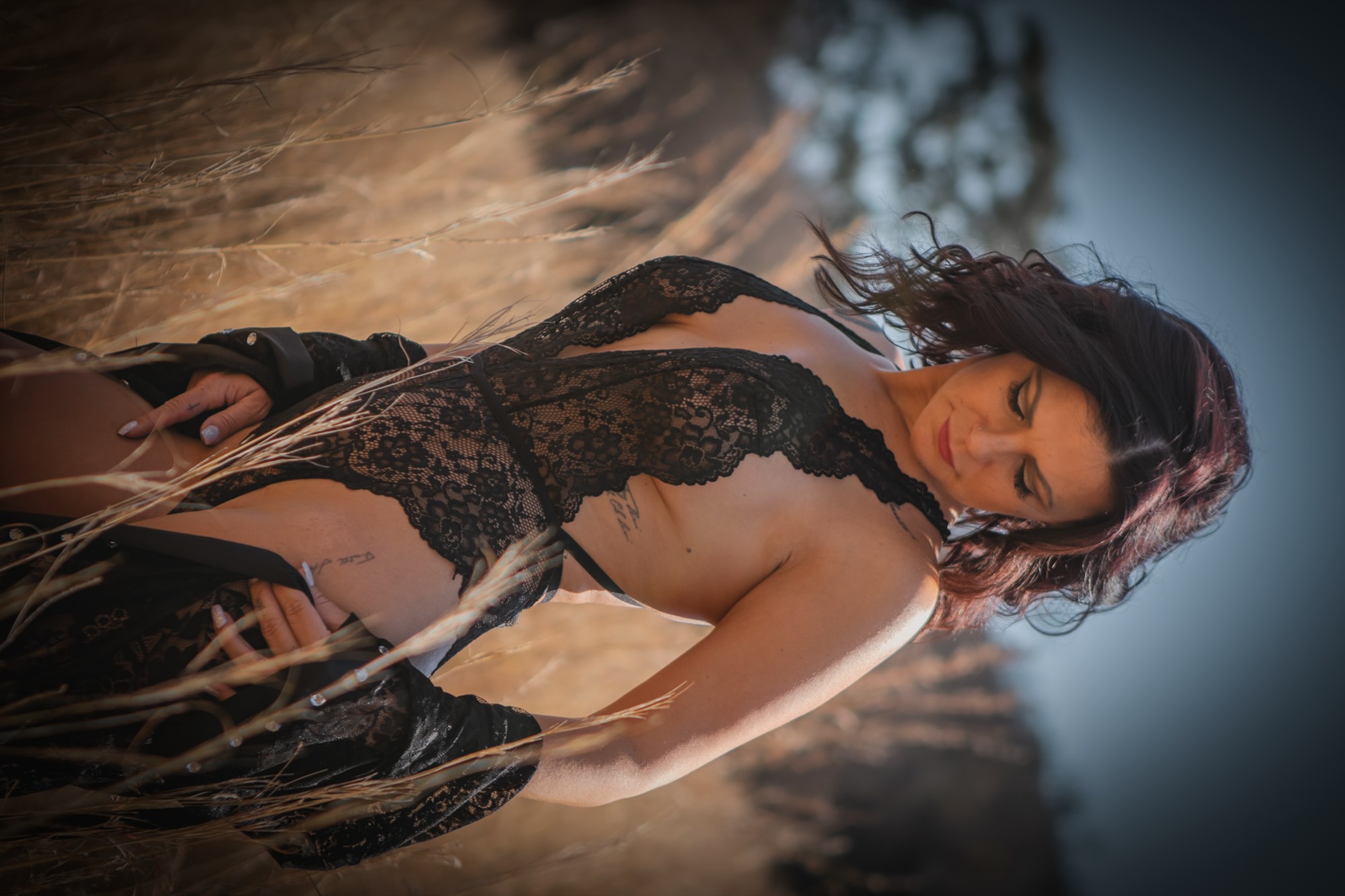 Intimate boudoir portrait wrapped in a soft blanket