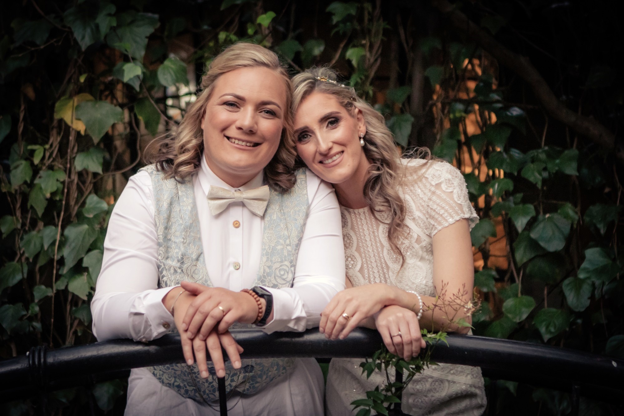 Couple kissing through a stone window