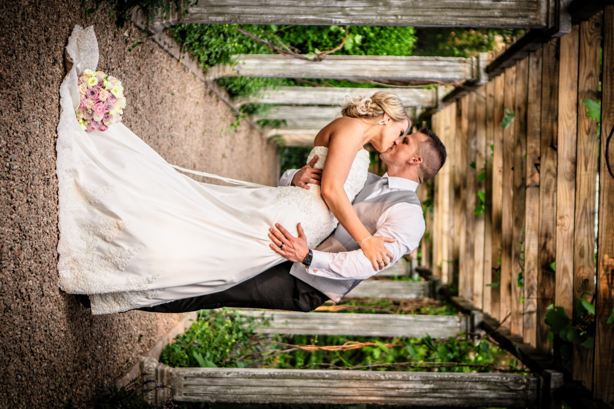 Wedding couple embracing outdoors