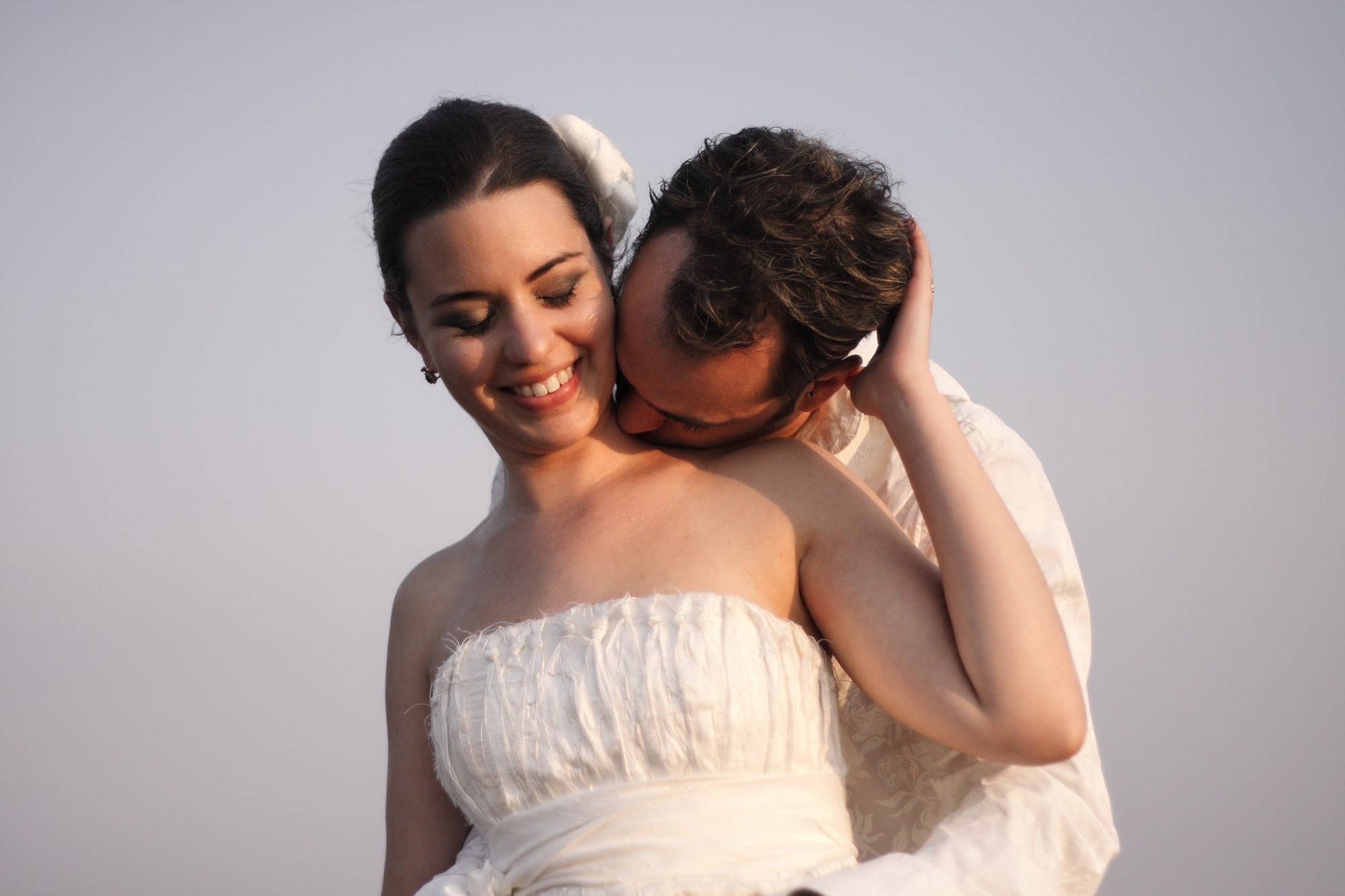 Same-sex couple smiling at the camera